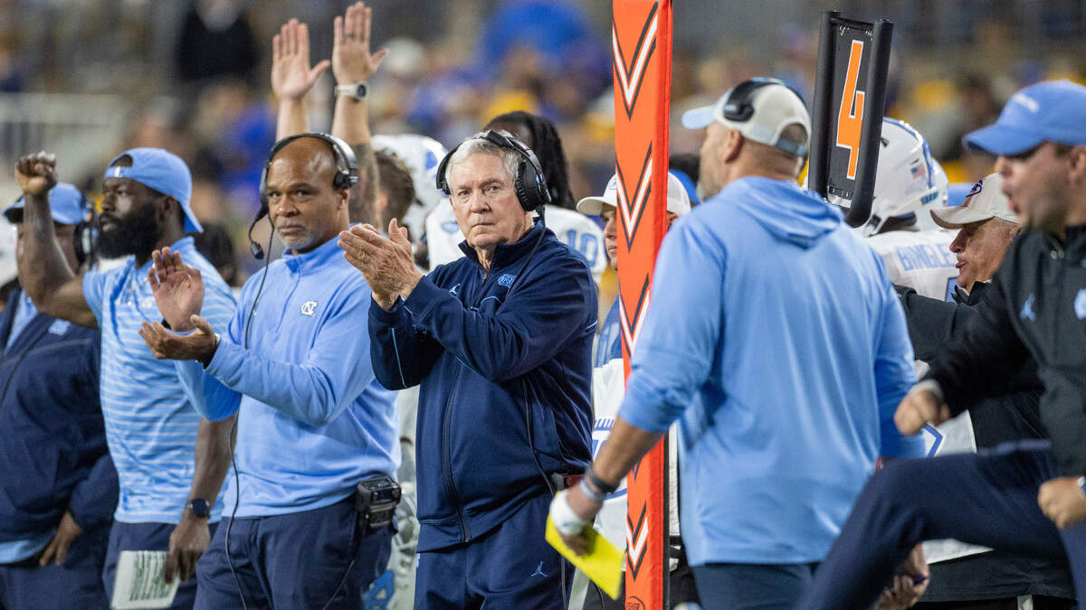 North Carolina coach Mack Brown and his assistants react after a field goal by Noah Burnett to take a 38-17 lead against Pitt in the third quarter on Saturday, September 23, 2023 at Acrisure Stadium in Pittsburgh, Pa.