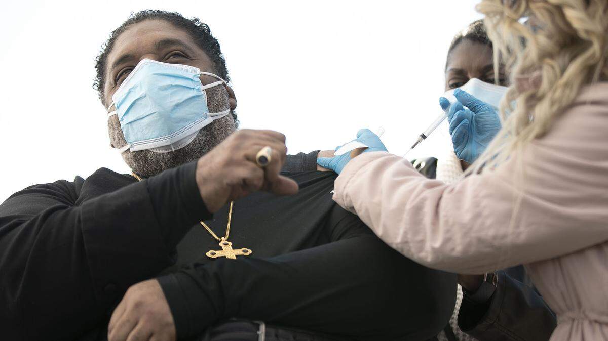 The Rev. William Barber receives the Johnson & Johnson COVID-19 vaccine on Friday, March 5, 2021 at PNC Arena in Raleigh, N.C.