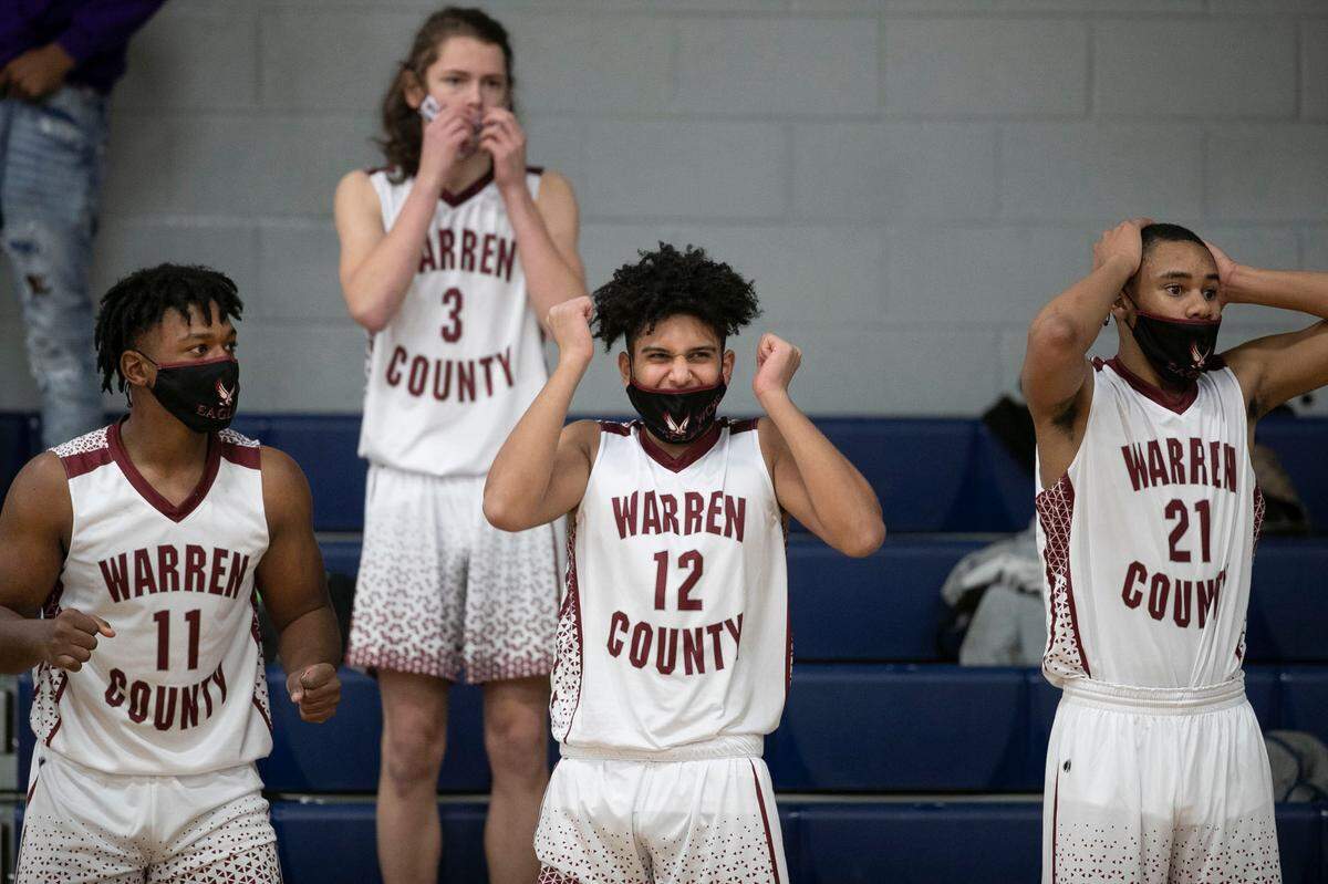 Warren County High School players Jah’Quell Hendrick (11), Rocky Carter (3), Youssef Elgarah (12) and Torrey Davis (21) react during some tense moments in their game against Bunn High School on Tuesday, February, 2, 2021 in Warrenton, N.C.