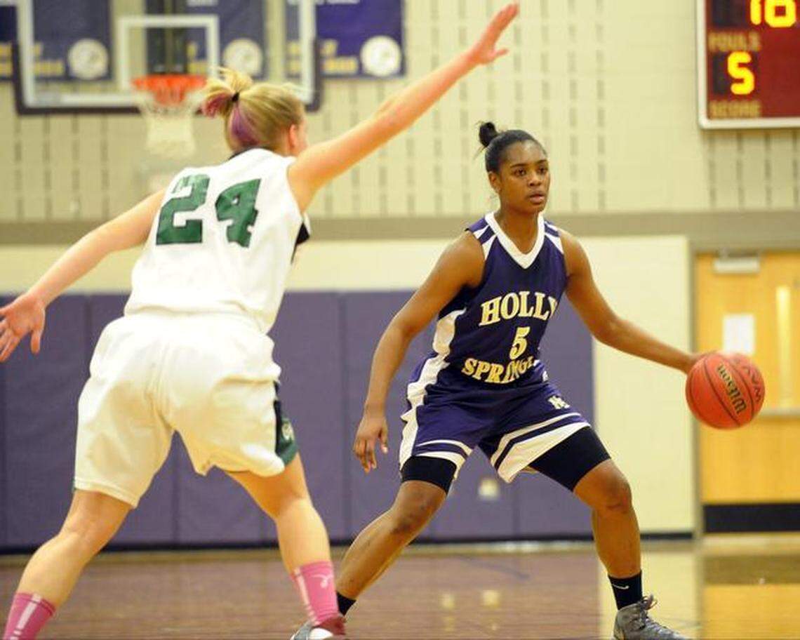 Holly Springs’ Kiara Leslie, right, returns as two-time conference player of the year.