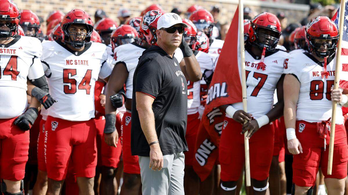N.C. State head coach Dave Doeren prepares to lead his team onto the field before the Wolfpack’s game against Duke at Wallace Wade Stadium in Durham, N.C., Sat. Sept. 20, 2025