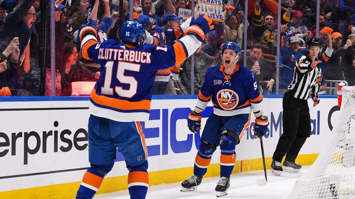 New York Islanders center Casey Cizikas (53) celebrates his goal with right wing Cal Clutterbuck (15) against the Carolina Hurricanes during the second period in game three of the first round of the 2023 Stanley Cup Playoffs at UBS Arena.