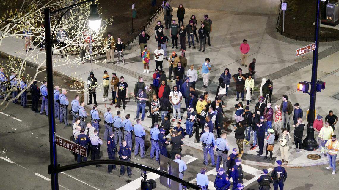 Law enforcement officers block protesters at Martin Street in downtown Raleigh early Wednesday morning, March 11, 2020 after hundreds of protesters marched throughout downtown Raleigh. Earlier, Raleigh police shot and injured a 26-year-old man who they say wouldnÕt drop his weapon.