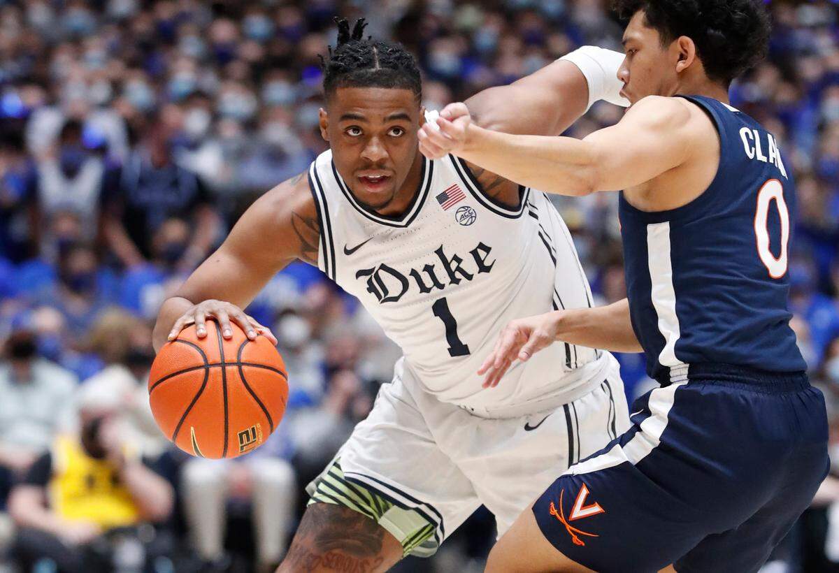 Duke’s Trevor Keels (1) drives as Virginia’s Kihei Clark (0) defends during Duke’s game against Virginia at Cameron Indoor Stadium in Durham, N.C., Monday, Feb. 7, 2022.