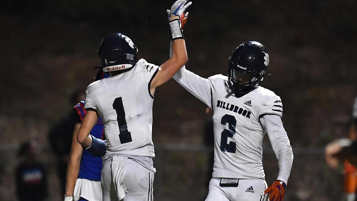 Millbrook’s Ty Broughton (1)) celebrates with Chase McClary (2) after Broughton’s touchdown against Sanderson in the second half. after The Sanderson Spartans and the Millbrook Wildcats met in a football game in Raleigh, N.C. on September 16, 2022.