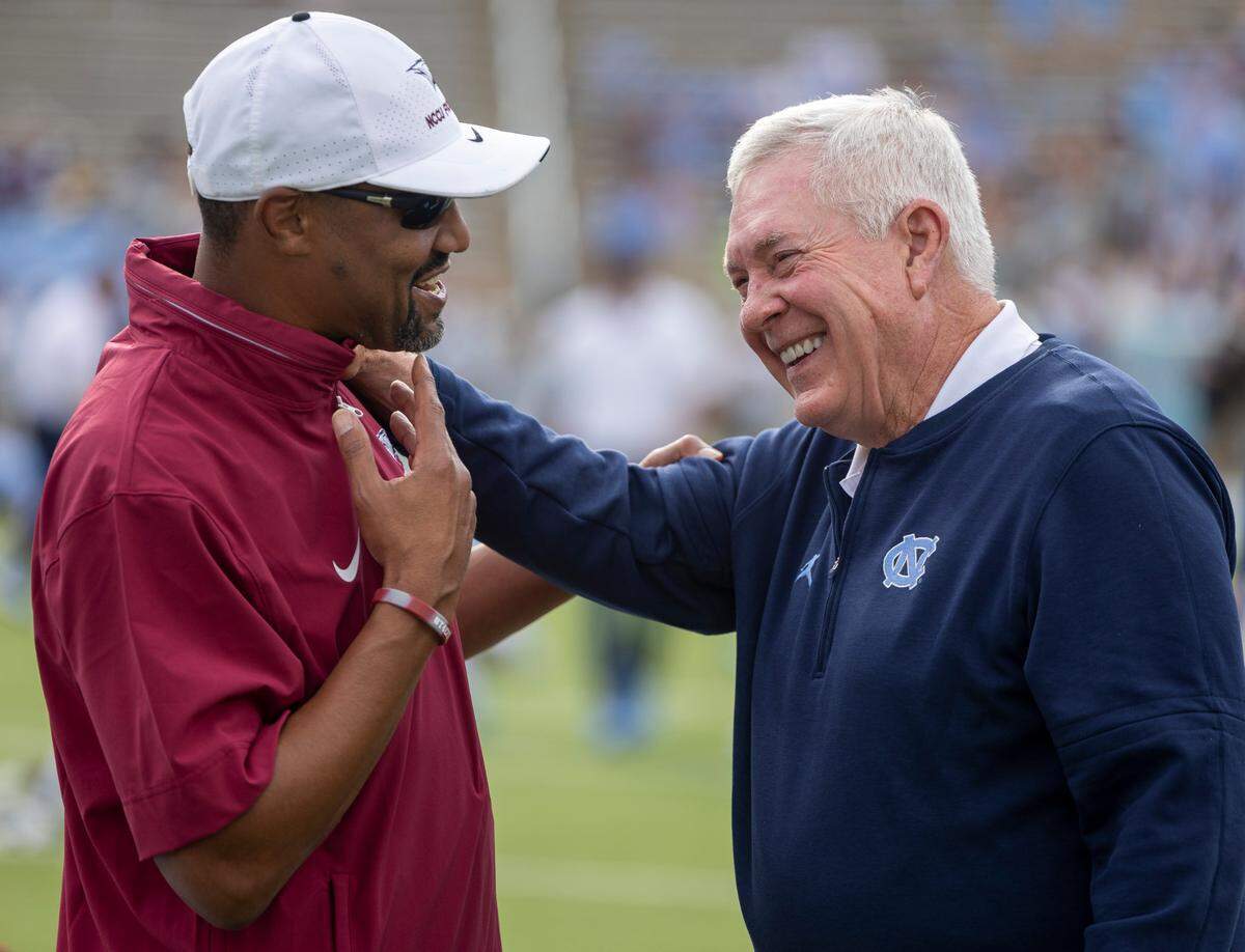North Carolina coach Mack Brown talks with North Carolina Central University head coach Trei Oliver prior to their game on Saturday, September 14, 2024 at Kenan Stadium in Chapel Hill, N.C.