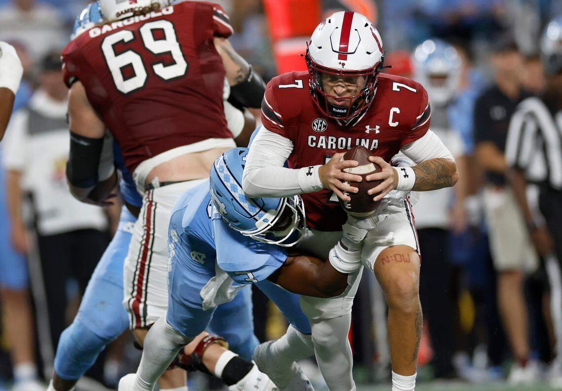 North Carolina linebacker Amari Gainer (3) sacks South Carolina quarterback Spencer Rattler (7) during the second half of UNC’s 31-17 victory over South Carolina in the Duke’s Mayo Classic at Bank of America Stadium in Charlotte, N.C., Saturday, Sept. 2, 2023.