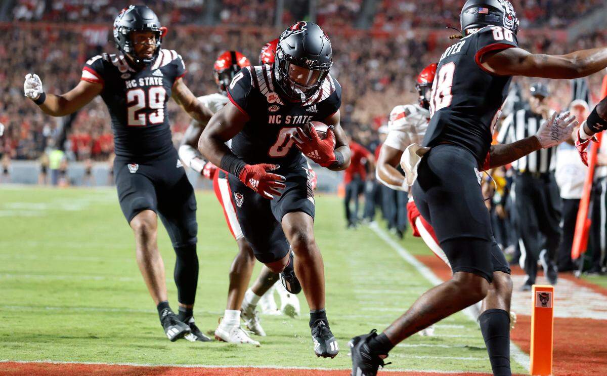 N.C. State running back Demie Sumo-Karngbaye (0) scores on a 14-yard touchdown run during the first half of N.C. States game against Texas Tech at Carter-Finley Stadium in Raleigh, N.C., Saturday, Sept. 17, 2022.