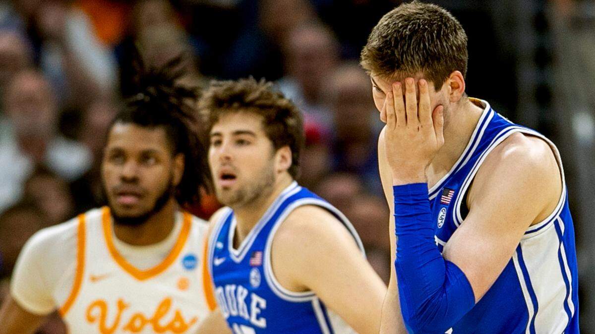 Duke’s Kyle Filipowski (30) reacts after being hit in the cheek in the first half against Tennessee during the second round of the NCAA Tournament on Saturday, March 18, 2023 at the Amway Center in Orlando, Fla