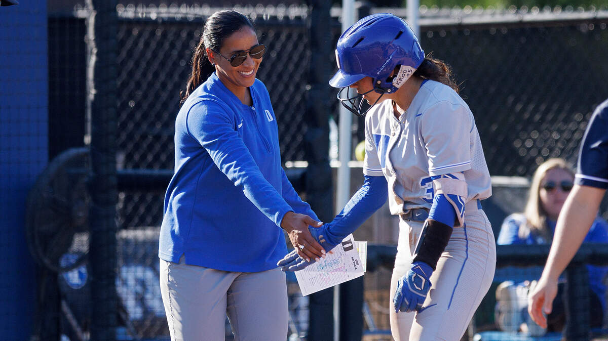 Duke’s Kelly Torres gets a high five from head coach Marissa Young after connecting for a triple during the sixth inning of the Blue Devils’ 6-0 win on Wednesday, April 24, 2024, in Durham, N.C.