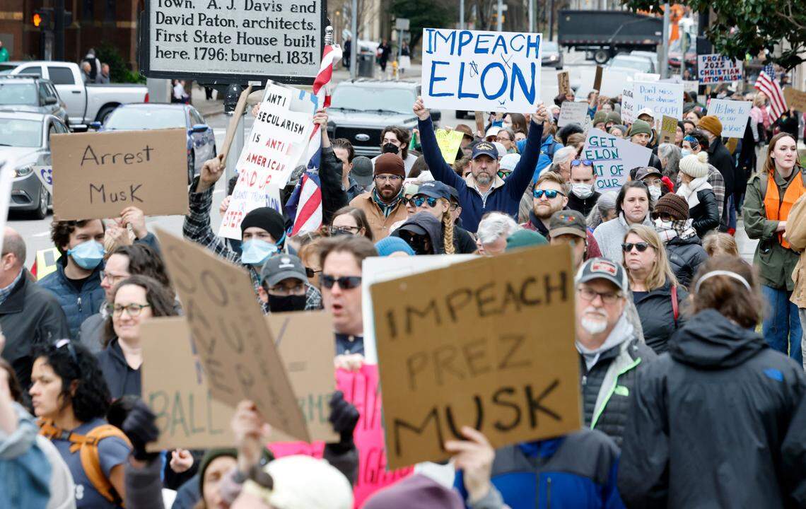 Protesters march around the North Carolina State Capitol building on Wednesday Feb. 5, 2025. The protest was part of a nationwide series of demonstrations in state capitals against the new administration of President Donald Trump and adviser Elon Musk.