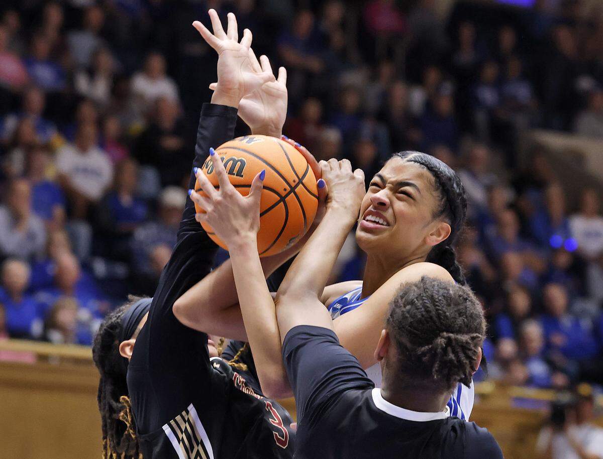 Duke’s Arianna Roberson is pressured by College of Charleston’s Marissa Brown and Taryn Barbot during the first half of the Blue Devils’ first-round NCAA Tournament game on Friday, March 20, 2026, at Cameron Indoor Stadium in Durham, N.C.