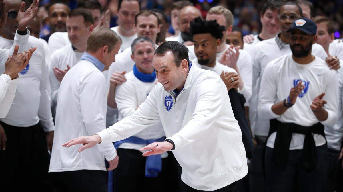 Duke head coach Mike Krzyzewski acknowledges the crowd during a pregame ceremony before Dukes game against UNC at Cameron Indoor Stadium in Durham, N.C., Saturday, March 5, 2022.
