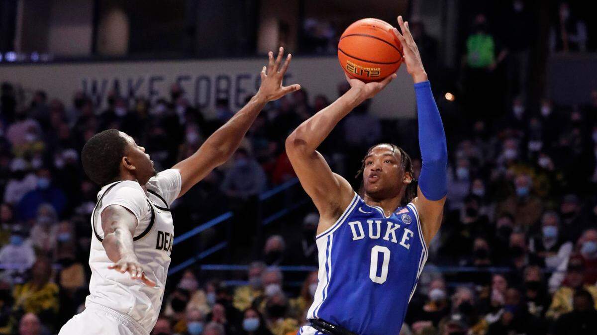 Duke’s Wendell Moore Jr. (0) shoots as Wake Forest’s Daivien Williamson (4) defends during the first half of Duke’s game against Wake Forest at LJVM Coliseum in Winston-Salem, N.C., Wednesday, January 12, 2022.