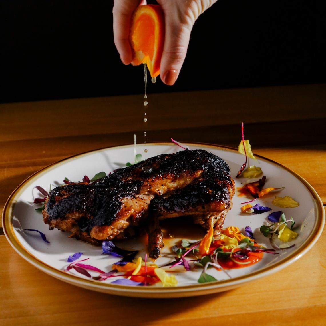 Bendito, a new restaurant opening in Raleigh this spring, will serve a modern Puerto Rican menu from chef Kevin Ruiz, including this grilled half chicken with a citrus marinade.