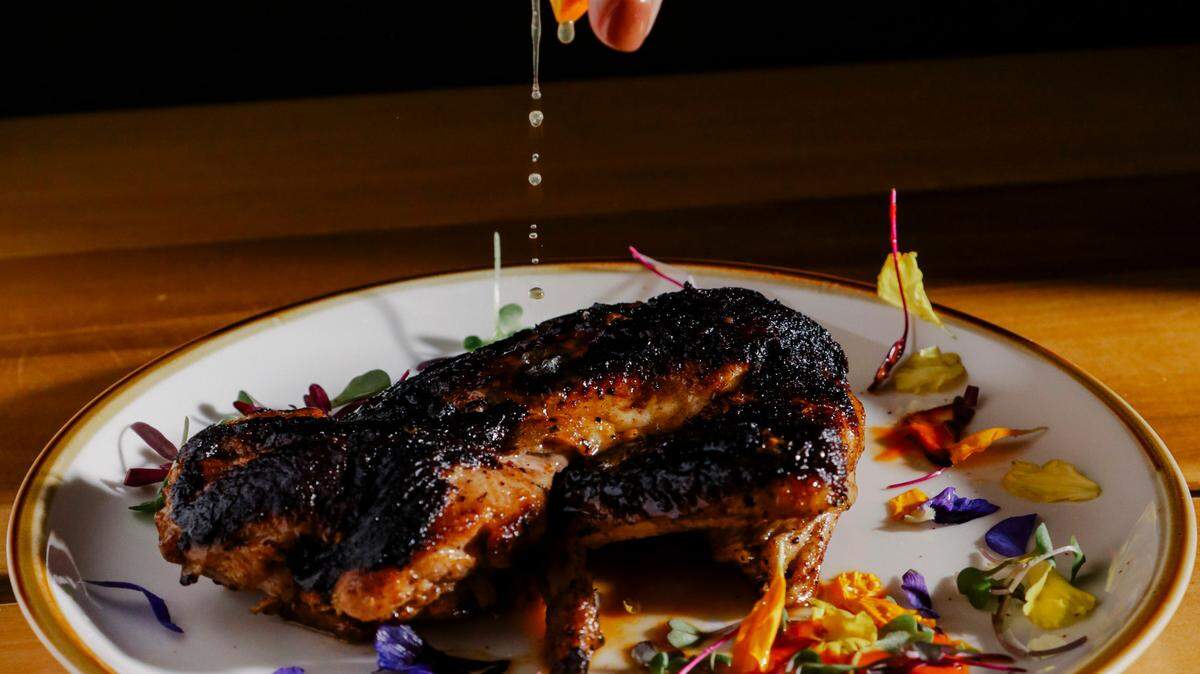 Bendito, a new restaurant opening in Raleigh this spring, will serve a modern Puerto Rican menu from chef Kevin Ruiz, including this grilled half chicken with a citrus marinade.
