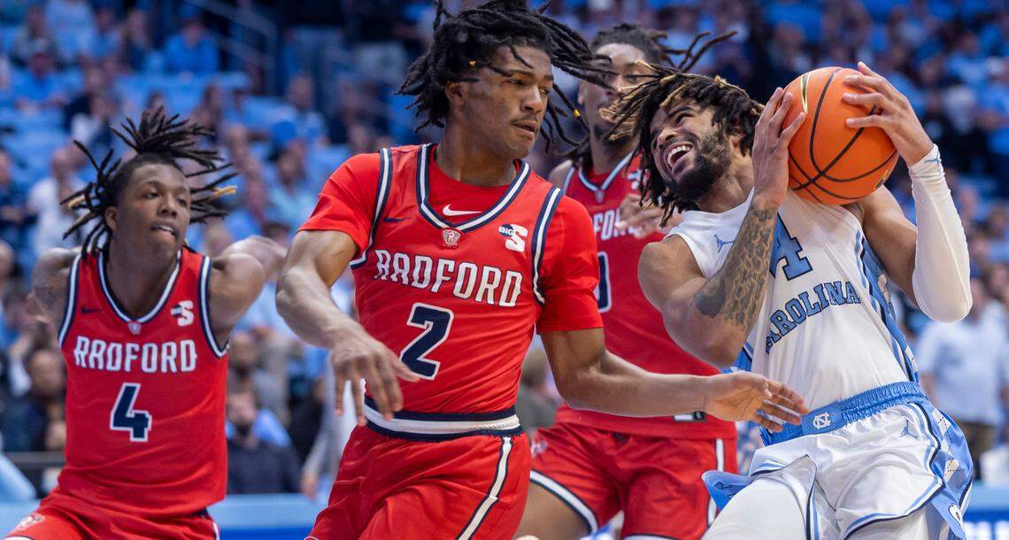 North Carolina’s R.J. Davis (4) drives against Radford’s Trenton Walters (2) and Truth Harris (4) in the second half on Monday, November 6, 2023 at the Dean Smith Center in Chapel Hill, N.C.