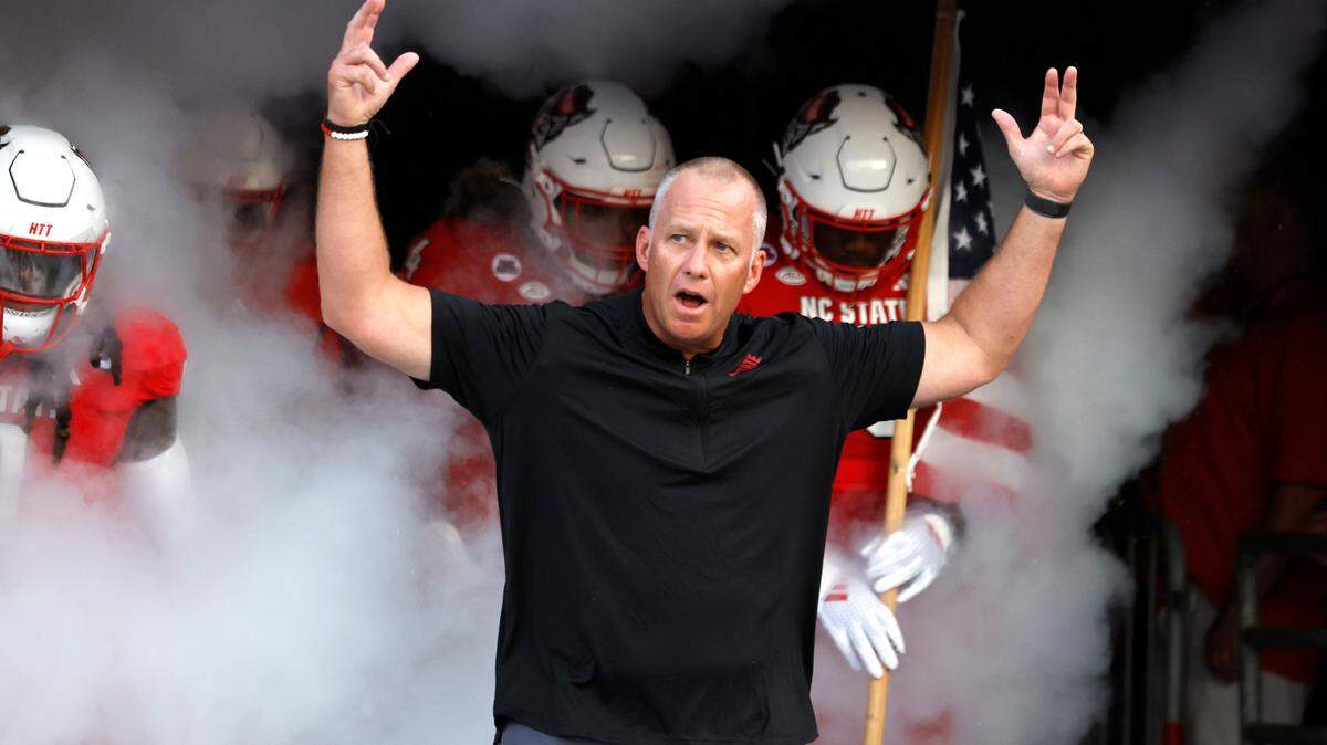 N.C. State head coach Dave Doeren leads the team out of the tunnel before taking the field before the Wolfpack’s game against Western Carolina at Carter-Finley Stadium in Raleigh, N.C., on Aug. 29, 2024.