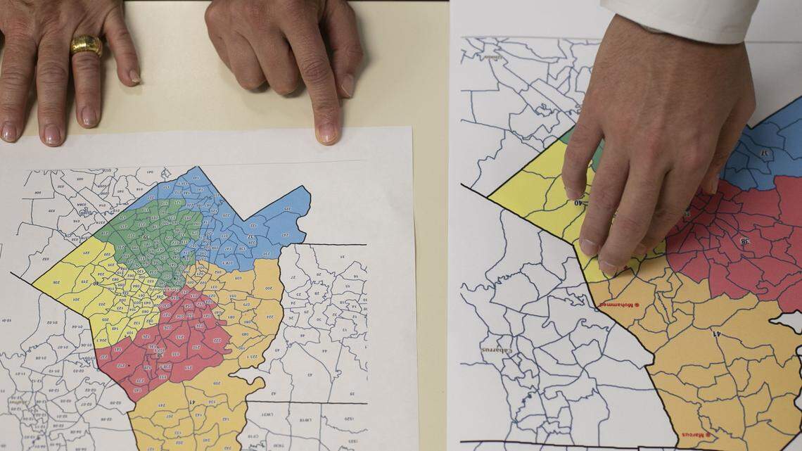 Legislative staff look over redistricting maps during a House committee meeting on Thursday, September 12, 2019 at the Legislative Office Building in Raleigh, N.C.