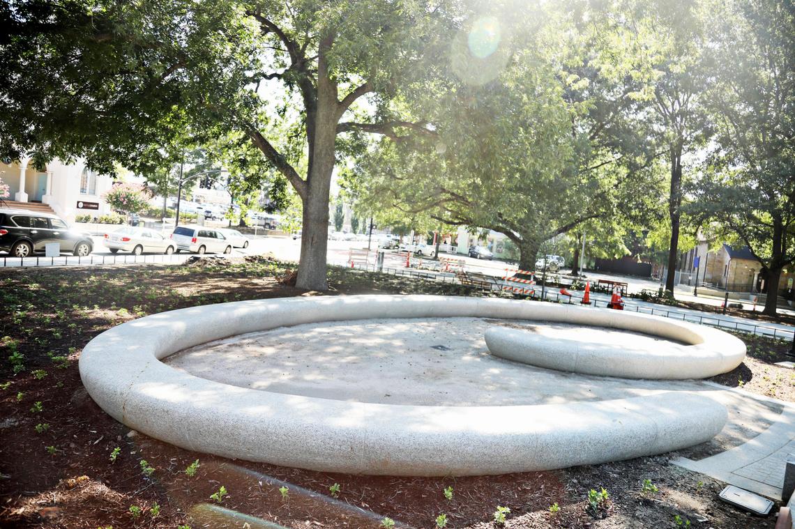Dallas landscape artist Brad Goldberg created the Grove Room, a curved spiral of granite seating, designed for intimate conversations, at Moore Square.