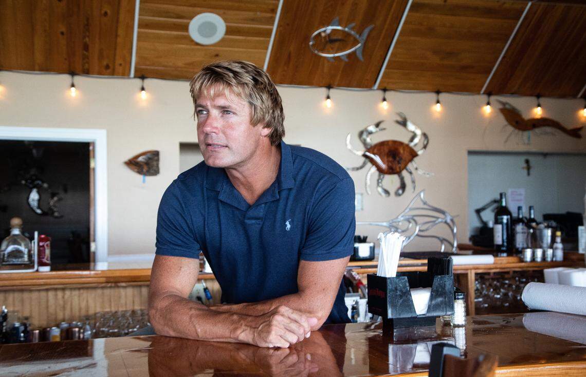 Sammy Boyd, owner of Southern Salt Seafood Company & Waterfront Restaurant works behind the bar, Wednesday, Aug. 12, 2018 in Morehead City. Boyd’s restaurant was one of the few business that remained open Wednesday ahead of Hurricane Florence’s expected landfall. 