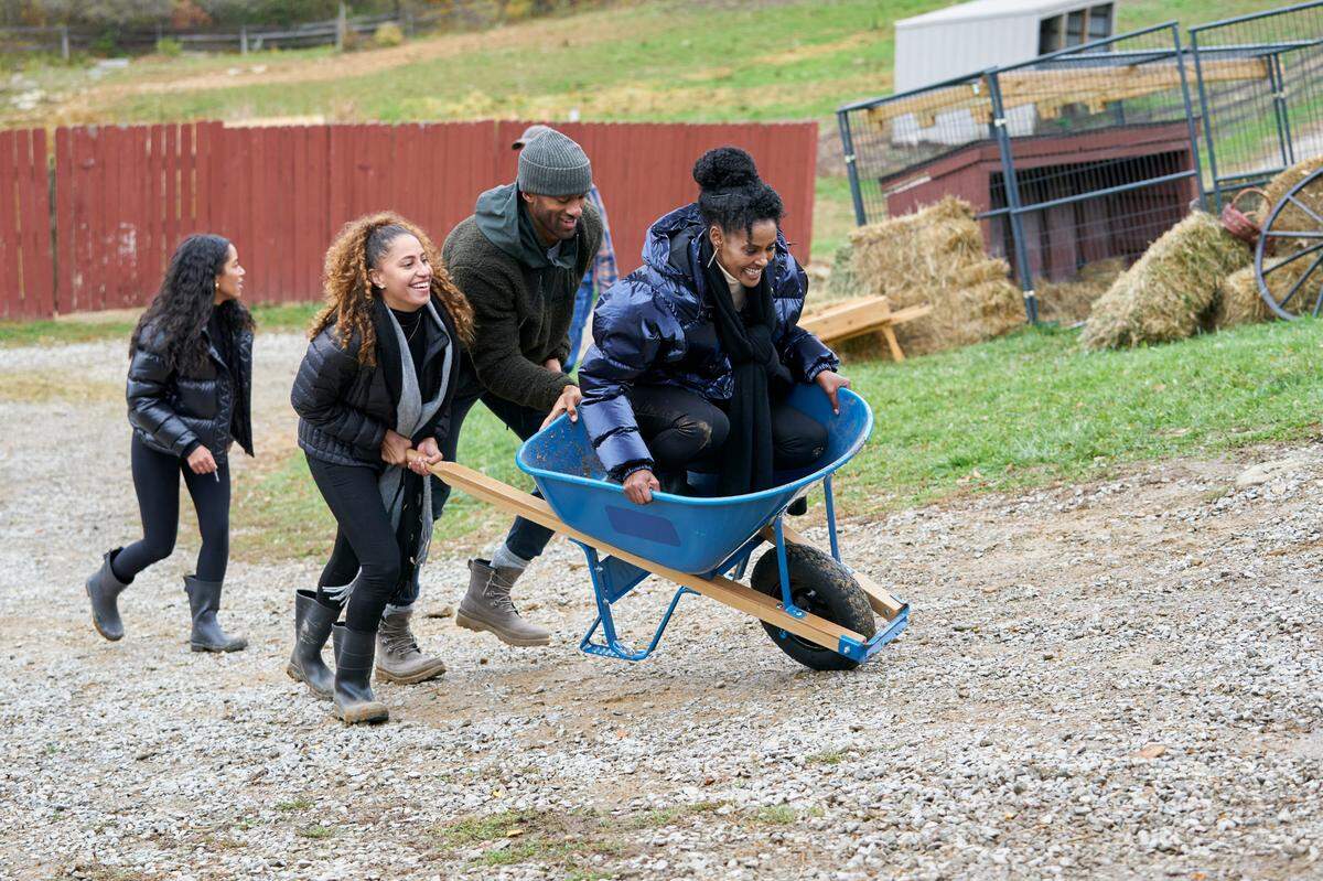 Matt James, a Raleigh native, with Ryan (left) and Magi (in wheelbarrow) in the Feb. 1, 2021, episode of “The Bachelor” on ABC.