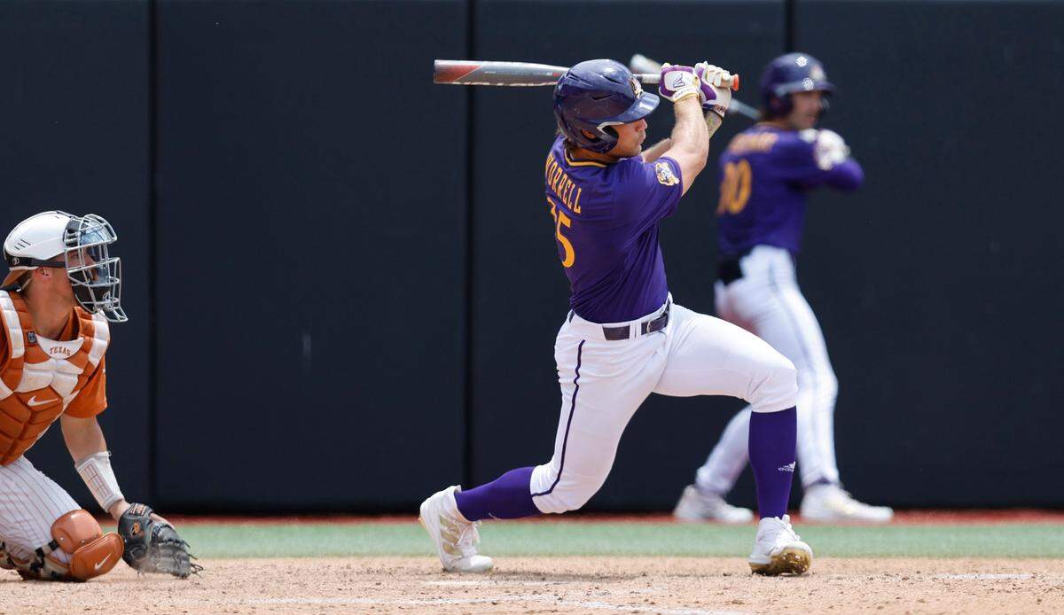 East Carolina’s Bryson Worrell (35) watches as he hits a two RBI double during ECUs game against Texas in the Greenville Super Regional at Clark-LeClair Stadium Saturday, June 11, 2022.