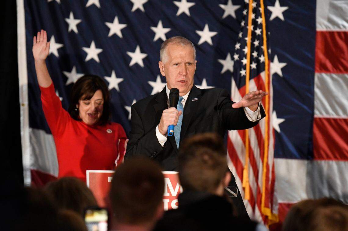 U.S. Sen. Thom Tillis of North Carolina addresses his supporters as wife Susan waves in the background after winning re-election during an election return party at Langtree Plantation in Mooresville, NC on Tuesday, November 3, 2020