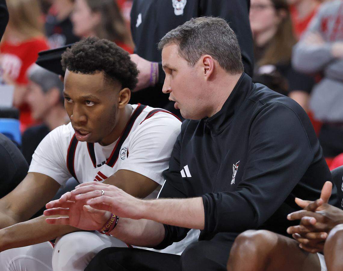 N.C. State's head coach Will Wade talks with N.C. State's Quadir Copeland on the bench during the second half of the Wolfpack’s 85-84 loss to Stanford on Saturday, March 7, 2026, at Lenovo Center in Raleigh, N.C.