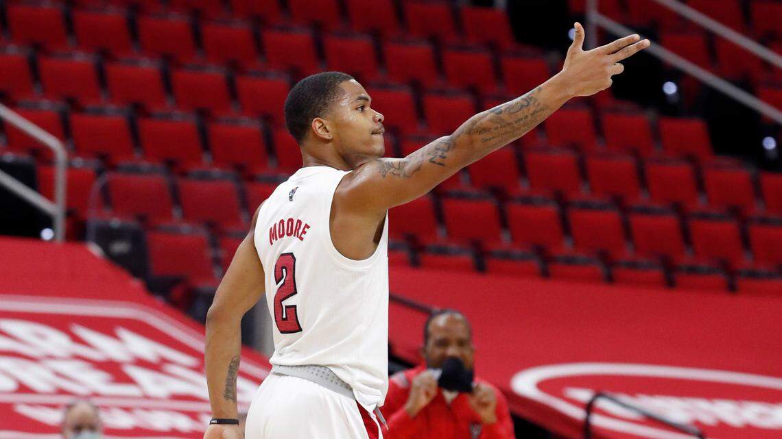 N.C. State’s Shakeel Moore (2) celebrates making a three-pointer during the first half of N.C. State’s game against UNC at PNC Arena in Raleigh, N.C., Tuesday, December 22, 2020.