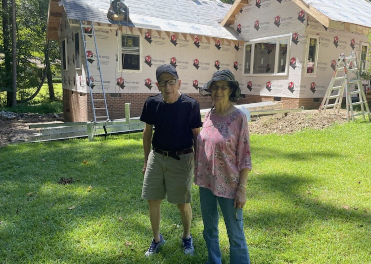 In 2023, Abby and Bob Millhauser posed in front of their accessory dwelling unit under construction at Alloway Court in Raleigh’s Patrick Commons subdivision.