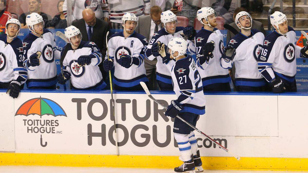 Winnipeg Jets left wing Nikolaj Ehlers (27) celebrates with teammates after scoring the third goal of his team during the third period of an NHL hockey game against the Florida Panthers at BB&T Center on Wednesday, January 4, 2017, in Sunrise.