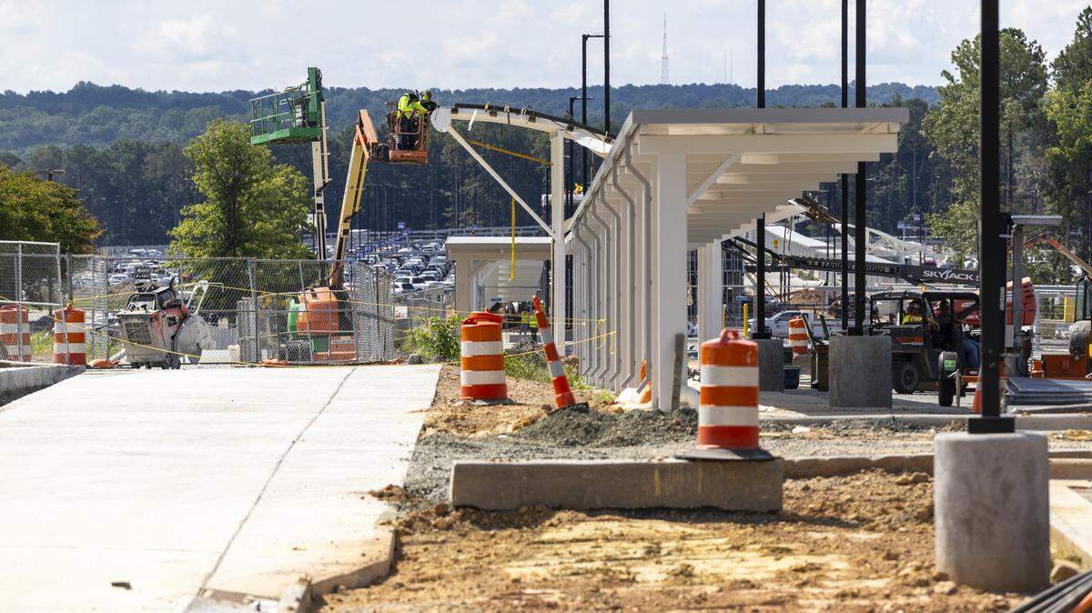 Contractors are building covered walkways at Park Economy 3, Raleigh-Durham International Airport’s largest remote lot off Aviation Parkway. Nearly 1,700 new spaces opened in June, and more will gradually come online through next summer.