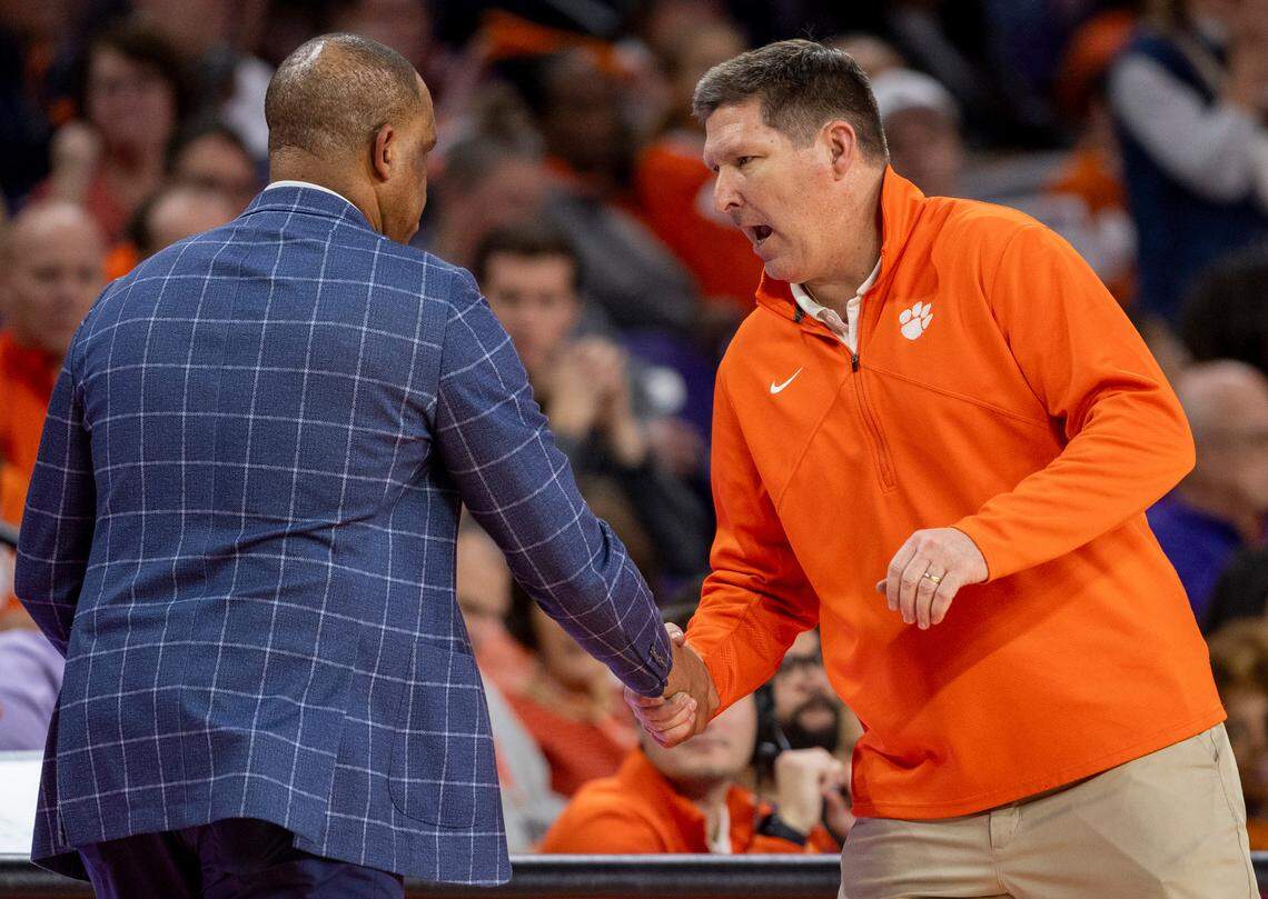 Clemson coach Brad Brownell congratulates North Carolina coach Hubert Davis following the Tar Heels 65-55 victory on Saturday, January 6, 2024 at Littlejohn Coliseum in Clemson, S.C.