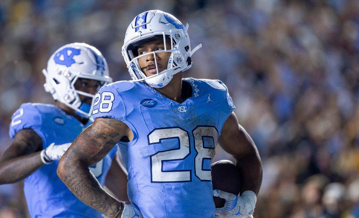 North Carolina running back Omarion Hampton (28) reacts after scoring a touchdown on a 17-yard carry in overtime to tie Appalachian State 34-34 on Saturday September 9, 2023 at Kenan Stadium in Chapel Hill, N.C.