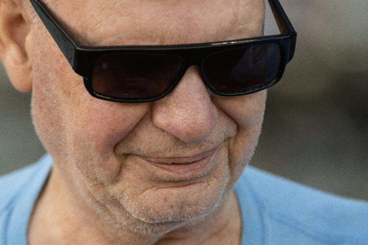 Tom Husketh stands on the sideline during a home game at South Granville High School. As an infant, an excess of oxygen in his incubator caused retrolental fibroplasia, damaging his retinas and resulting in blindness.