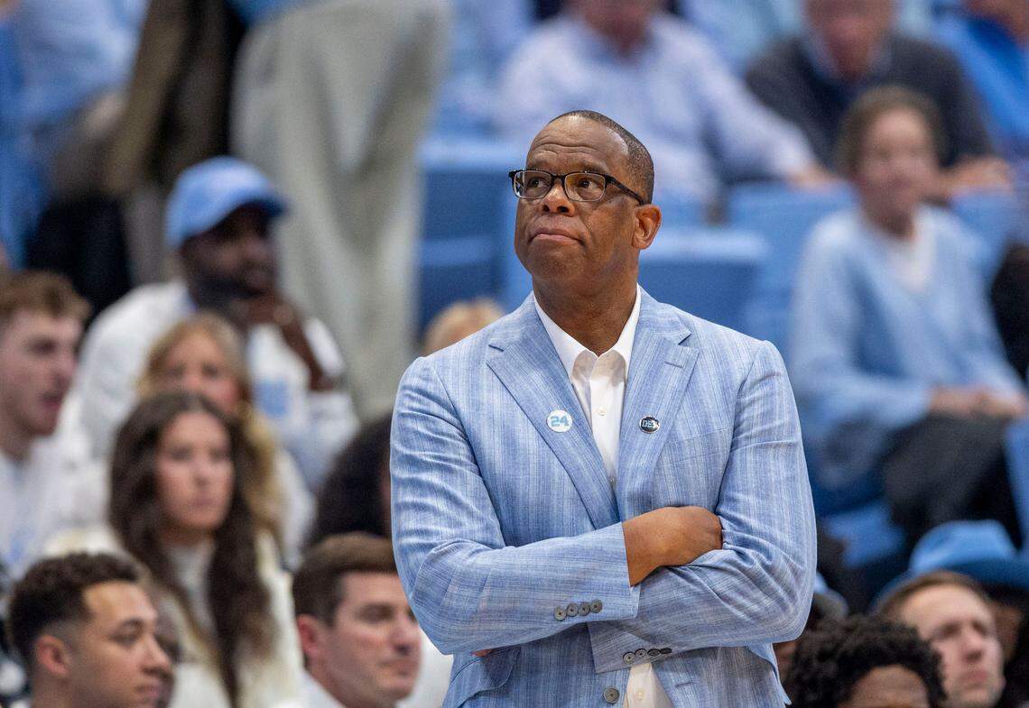 Down by 15 points in the second half against Alabama, North Carolina coach Hubert Davis, with arms folded, glances at the scoreboard on Wednesday, December 4, 2024 at the Smith Center in Chapel Hill, N.C. Alabama rolled to a 94-79 victory.