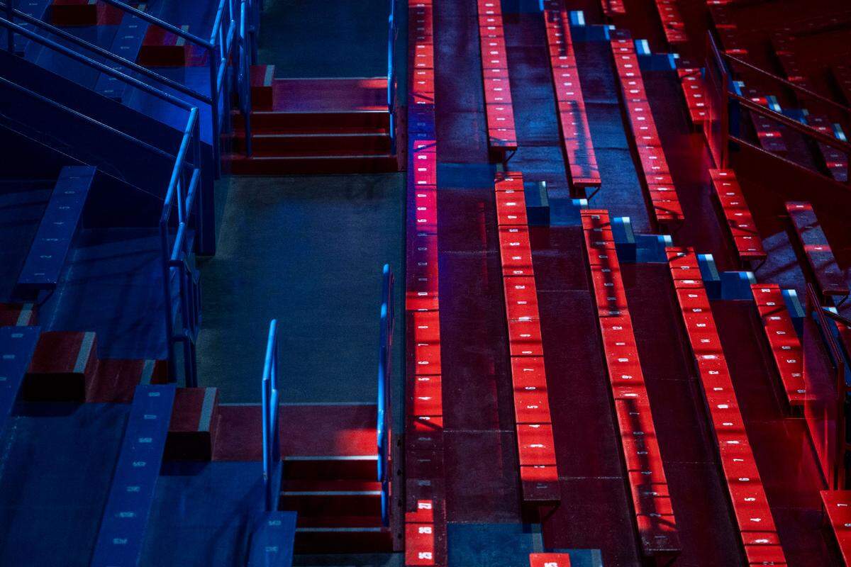 The morning sunshine illuminates the red seats in the historic Allen Fieldhouse on Thursday, November 7, 2024 in Lawrence, Kansas.