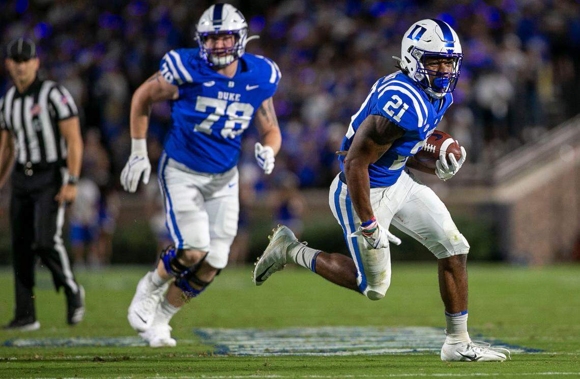 Duke’s Mataeo Durant (21) looks for running room as he romps 19 yards in the second quarter for the first of three touchdowns against North Carolina A&T on Friday, September 10, 2021 at Wallace Wade Stadium in Durham, N.C.