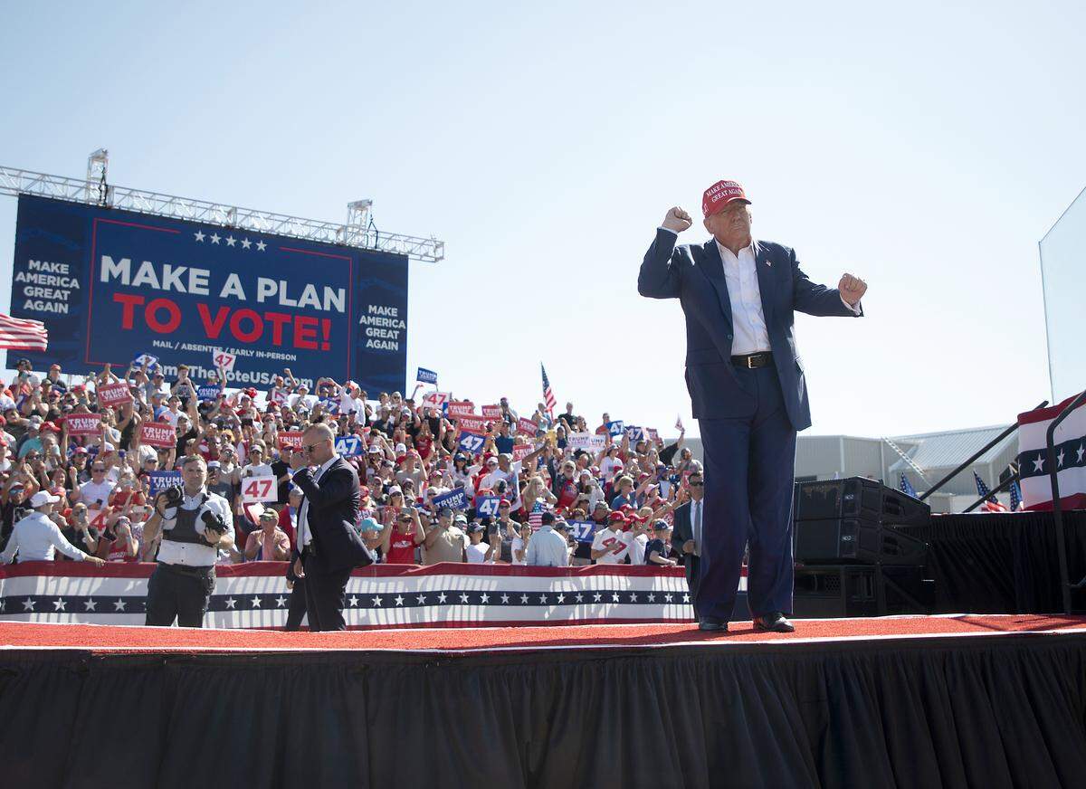 Former President and current Republican candidate for president Donald Trump dances at the conclusion of his remarks during a rally in Wilmington, N.C. on Saturday, Sept. 21, 2024.