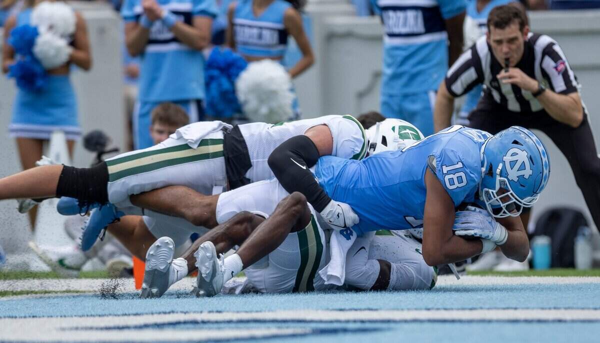 North Carolina tight end Bryson Nesbitt (18) scores a touchdown on a 30-yard pass reception from quarterback Conner Harrell (15) in the first quarter against Charlotte on Saturday, September 7, 2024 at Kenan Stadium in Chapel Hill, N.C.