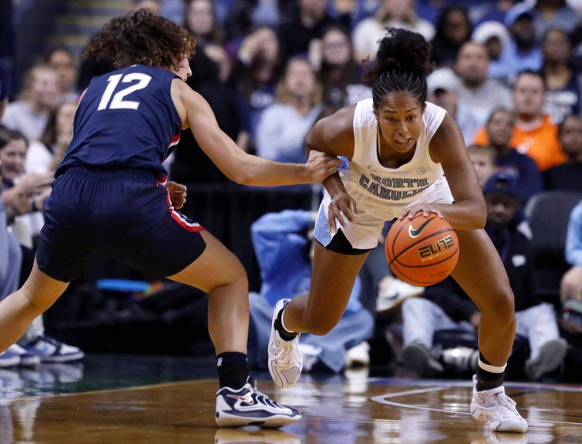 North Carolina’s Indya Nivar steals the ball from UConn’s Ashlynn Shade during the first half of the Tar Heels’ 69-58 loss on Friday, Nov. 15, 2024, at First Horizon Coliseum in Greensboro, N.C.