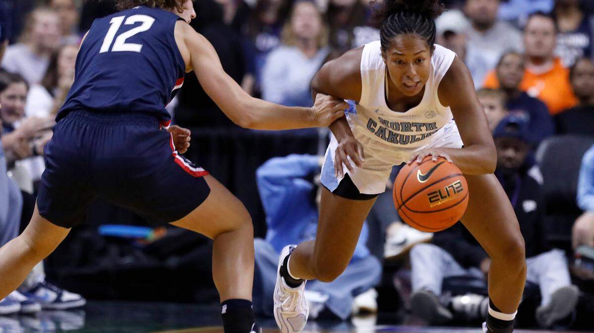 North Carolina’s Indya Nivar steals the ball from UConn’s Ashlynn Shade during the first half of the Tar Heels’ 69-58 loss on Friday, Nov. 15, 2024, at First Horizon Coliseum in Greensboro, N.C. 