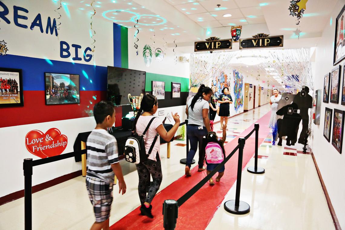 When students first enter Barwell Road Elementary School on Wednesday, July 25, 2018, they walk a “red carpet” with flashing lights and a group of teachers to greet them. The school is holding two half-day orientation sessions for parents and students before the school year begins Friday. 