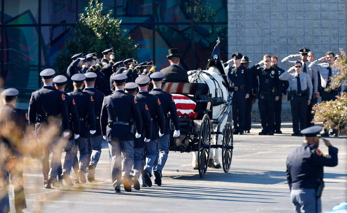 A funeral caisson transports the casket of Raleigh Police Officer Gabriel Torres to Cross Assembly Church in Raleigh, N.C. for his funeral Saturday, Oct. 22, 2022.