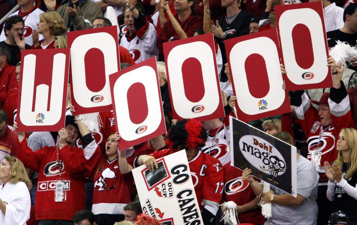 Carolina fans cheer on the Hurricanes as they take the ice against Edmonton in game 5 of the Stanley Cup Final on Wednesday, June 14, 2006 at the RBC Center.