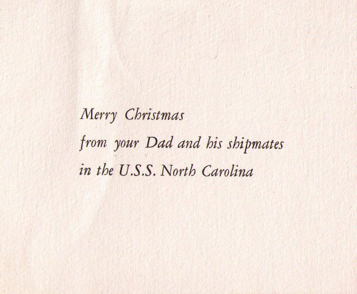 The inscription to a Christmas card sent by Macy’s to children with family on board the USS North Carolina in 1943.