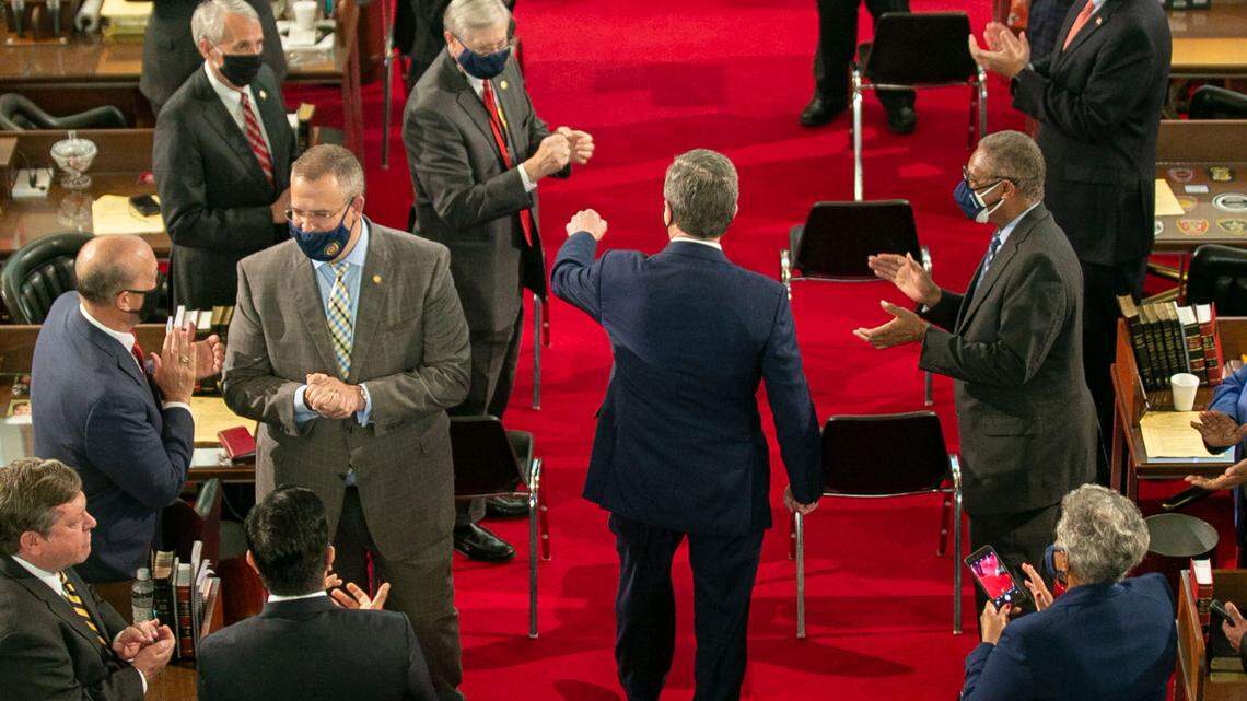 North Carolina Gov. Roy Cooper is greeted by lawmakers as he enters the House chamber to deliver his State of the State address before a joint session of the North Carolina House and Senate on Monday, April 26, 2021 in Raleigh, N.C.