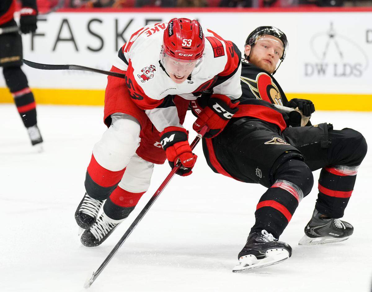 Nikolas Matinpalo, right, of the Ottawa Senators battles for position against Jackson Blake of the Carolina Hurricanes during the first period of Game 4 of their first-round Stanley Cup Playoff series at Canadian Tire Centre on April 25, 2026 in Ottawa, Canada.