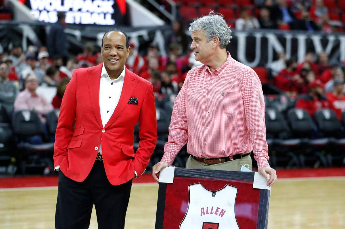 N.C. State head coach Kevin Keatts talks with athletic director Boo Corrigan during the ceremony honoring seniors before N.C. State’s game against UNC at PNC Arena in Raleigh, N.C., Saturday, Feb. 26, 2022.